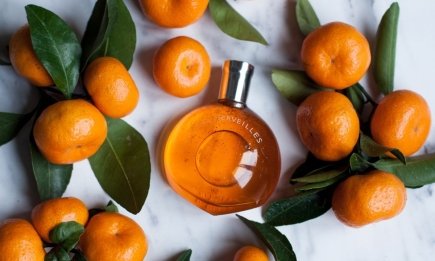 Ароматы для новогоднего образа: 5 духов с нотами шампанского, мандаринов и специй, создающих магию